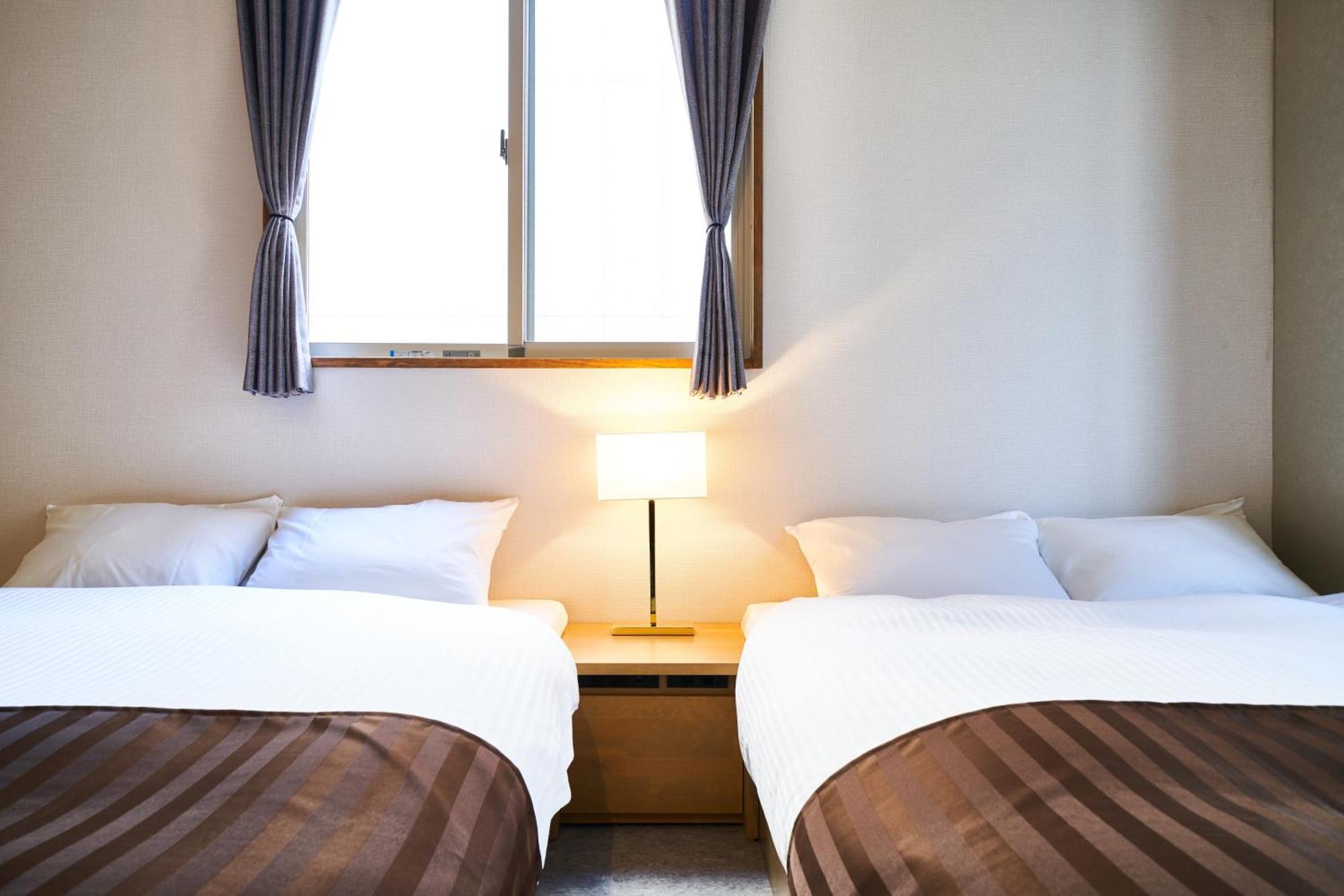 &And Hostel Shinsaibashi East Osaka Rum bild
